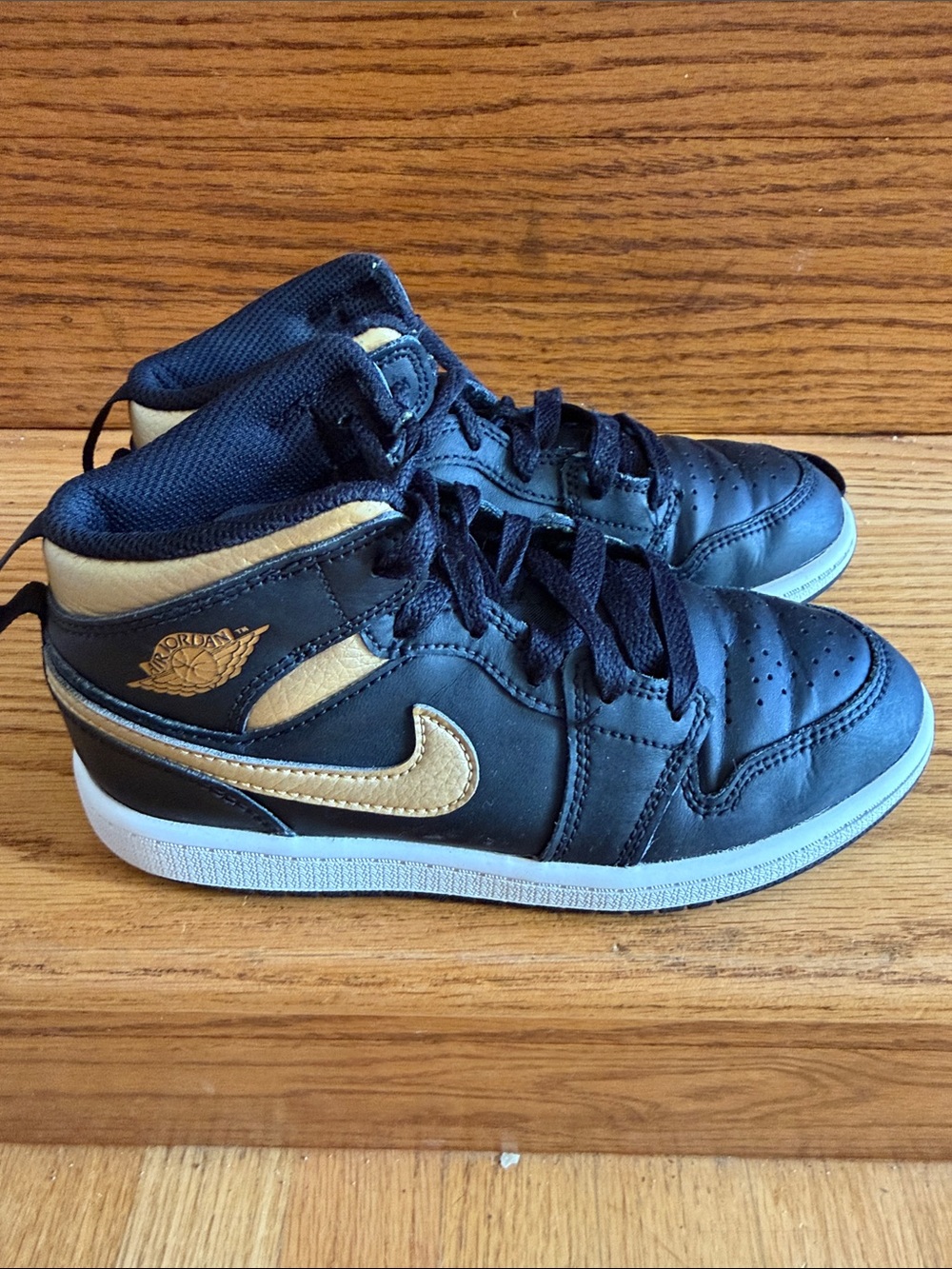 Nike Air Jordan Sneakers in Black and Gold